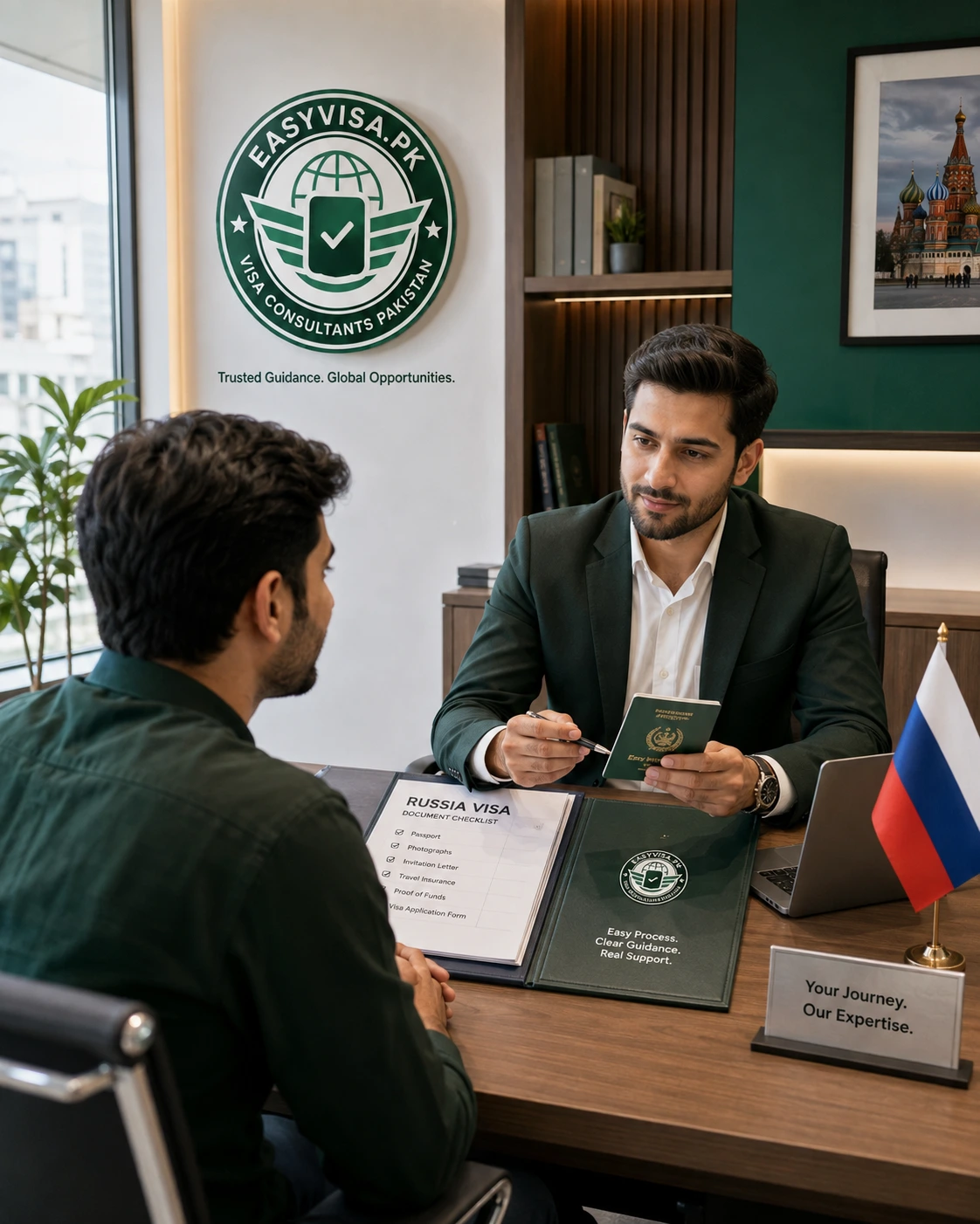 Pakistani applicant reviewing Russia visa documents with an EasyVisa consultant in a professional office